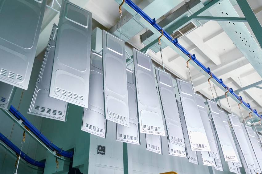 Metal parts undergo degreasing and rinsing